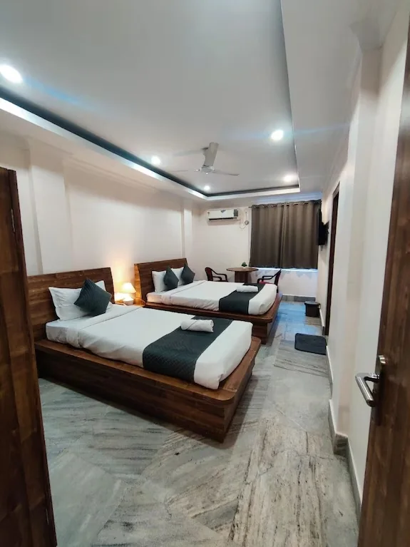 Family room with two beds at Karnataka State Guest House